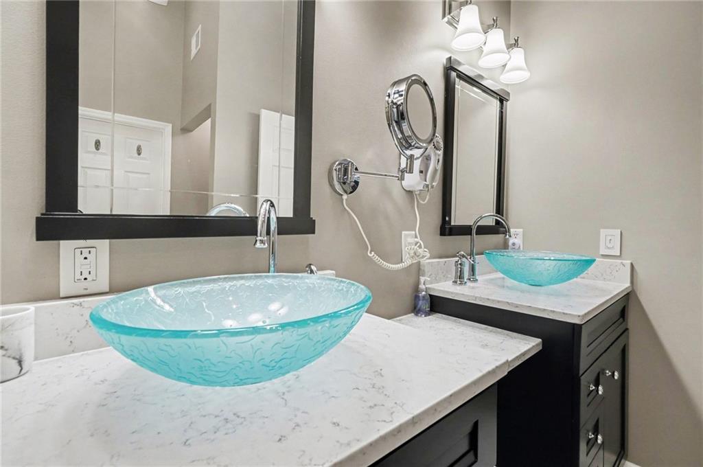 65 Indian Hills Drive Rydal, GA 30171 - Photo 17 of 32 a bathroom with a sink and a mirror