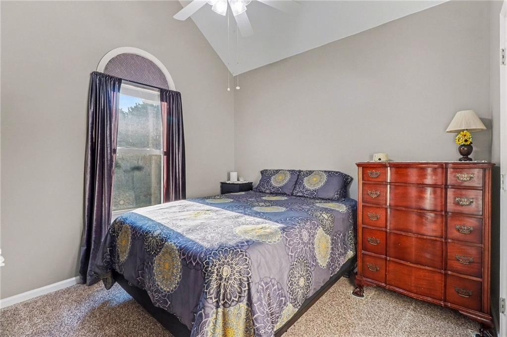 65 Indian Hills Drive Rydal, GA 30171 - Photo 21 of 32 a bedroom with a bed and a dresser