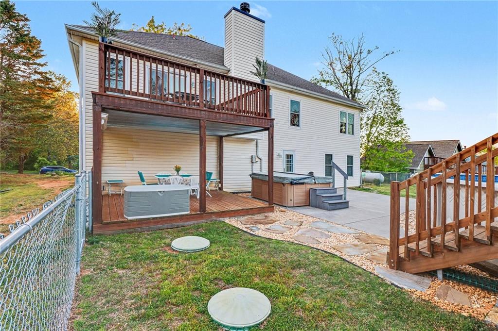 65 Indian Hills Drive Rydal, GA 30171 - Photo 30 of 32 a view of an house with backyard space and balcony