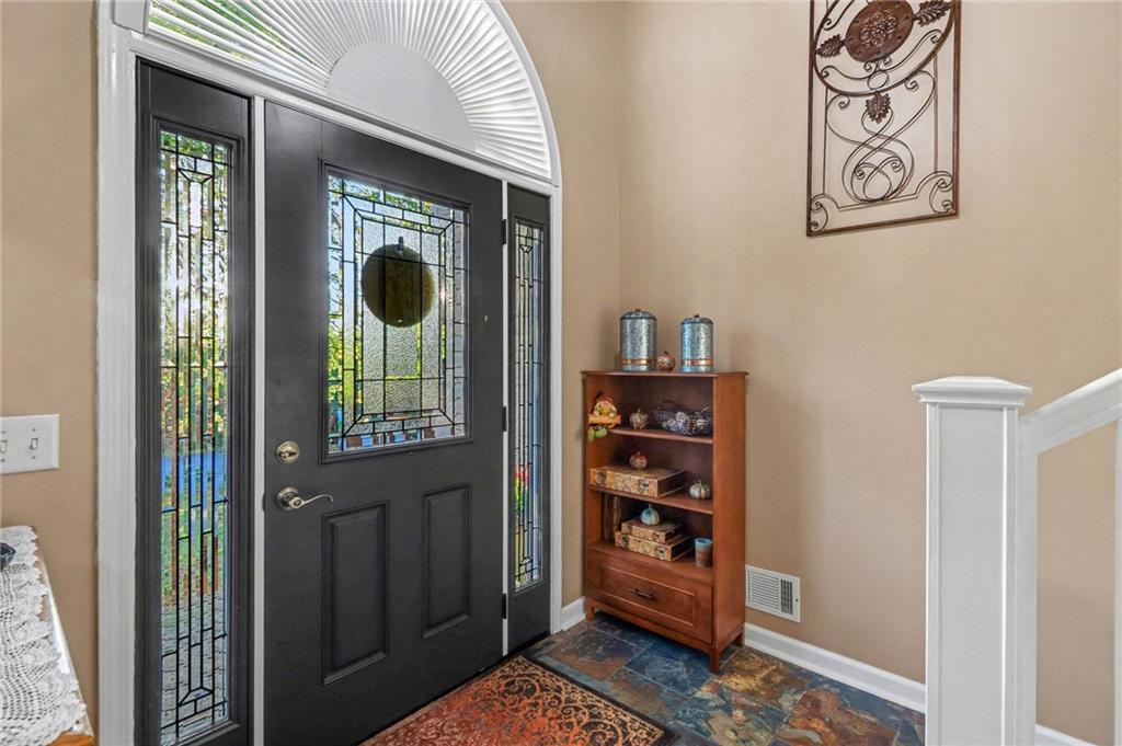 65 Indian Hills Drive Rydal, GA 30171 - Photo 4 of 32 a view of a wooden door and an outdoor space