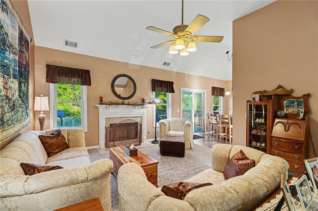 65 Indian Hills Drive Rydal, GA 30171 - Photo 5 of 32 a living room with furniture and a fireplace