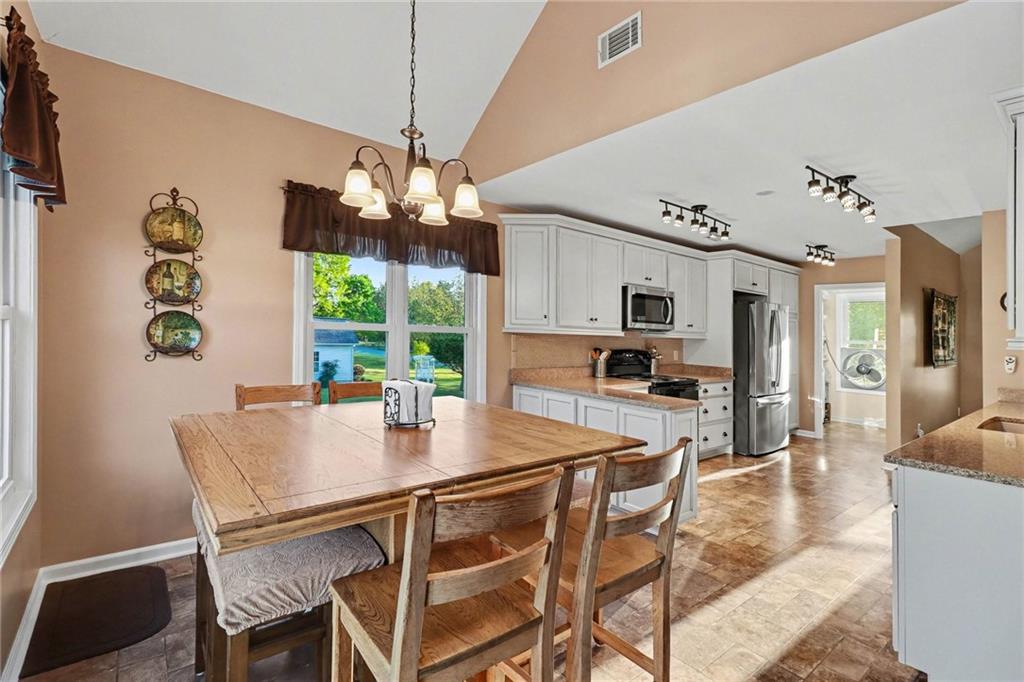 65 Indian Hills Drive Rydal, GA 30171 - Photo 8 of 32 a view of a dining room with furniture window and outside view