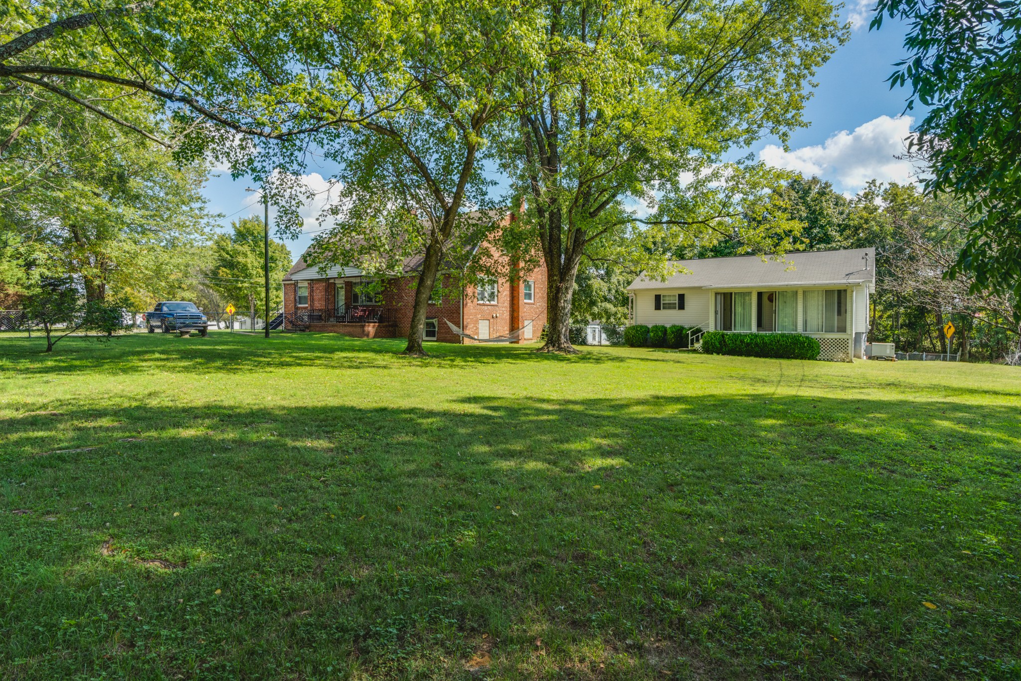 8915 Lyles Road Lyles, TN 37098 - Photo 1 of 39 a view of a house with a big yard