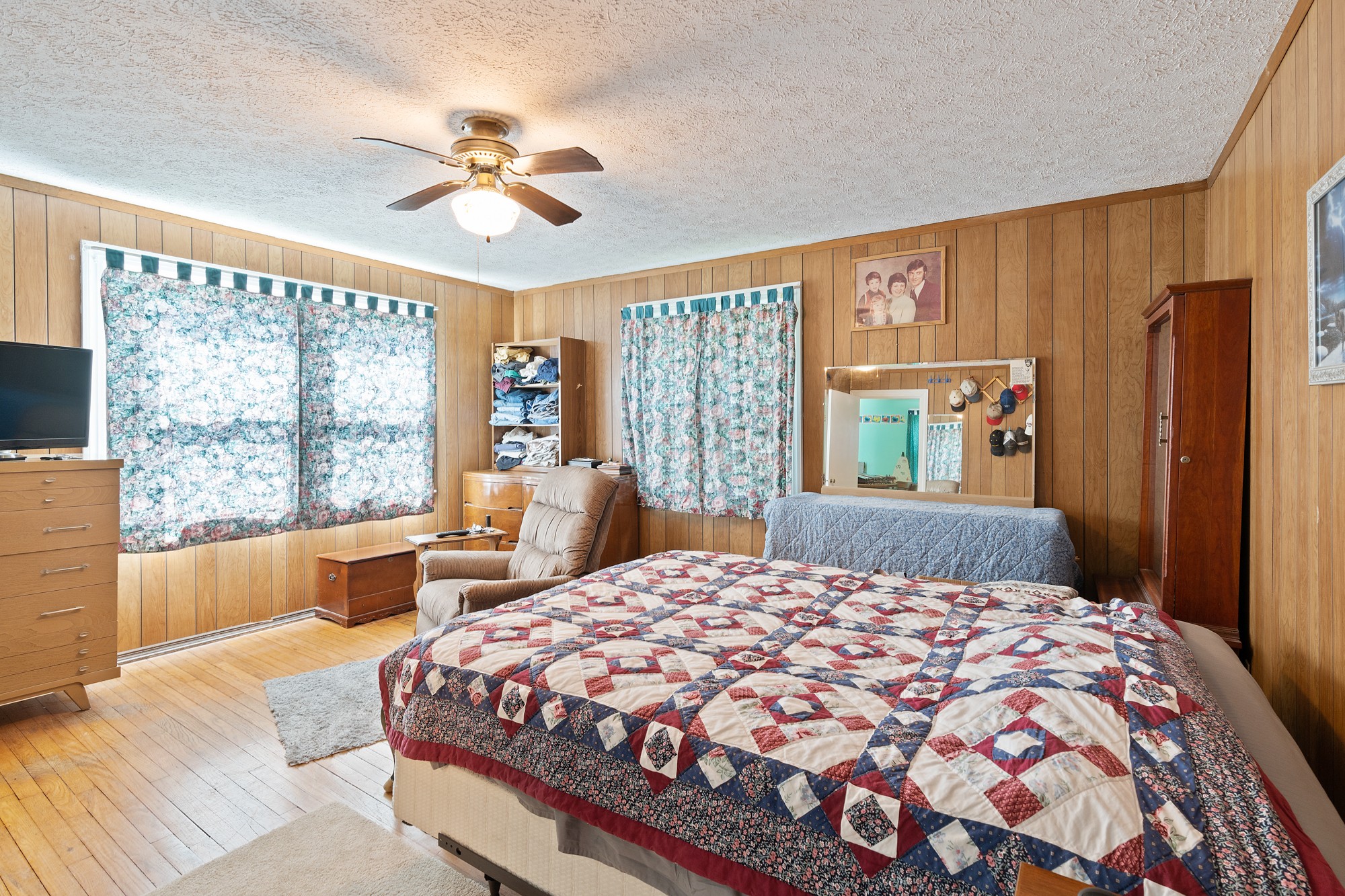 8915 Lyles Road Lyles, TN 37098 - Photo 14 of 39 a bedroom with a large bed and a window