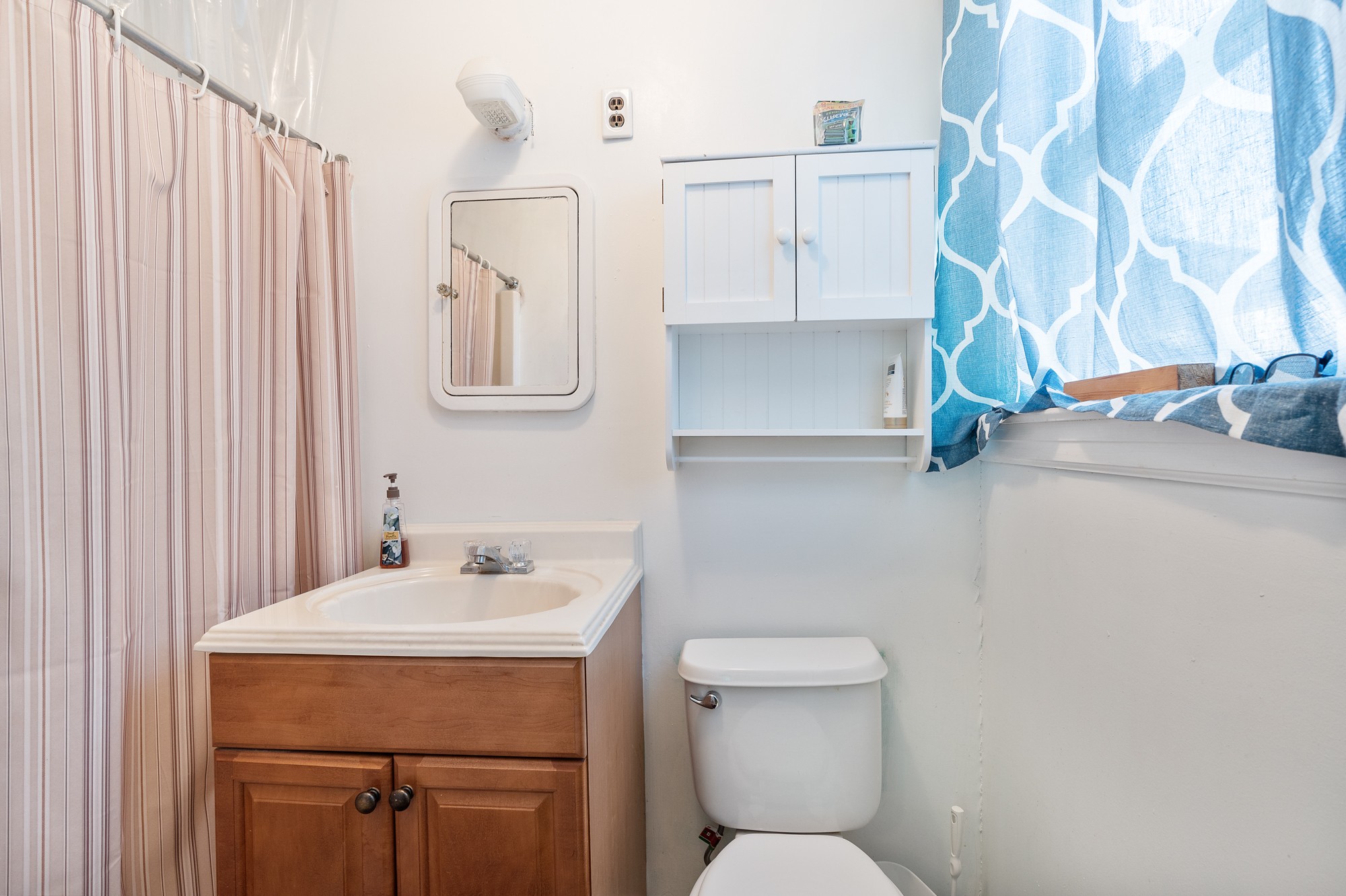 8915 Lyles Road Lyles, TN 37098 - Photo 16 of 39 a bathroom with a sink toilet and shower