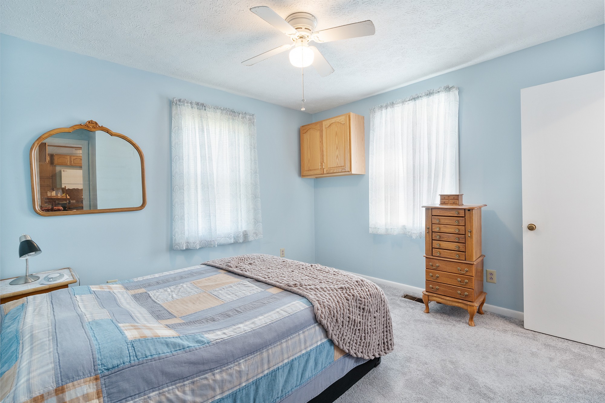8915 Lyles Road Lyles, TN 37098 - Photo 17 of 39 a bedroom with a bed and a painting