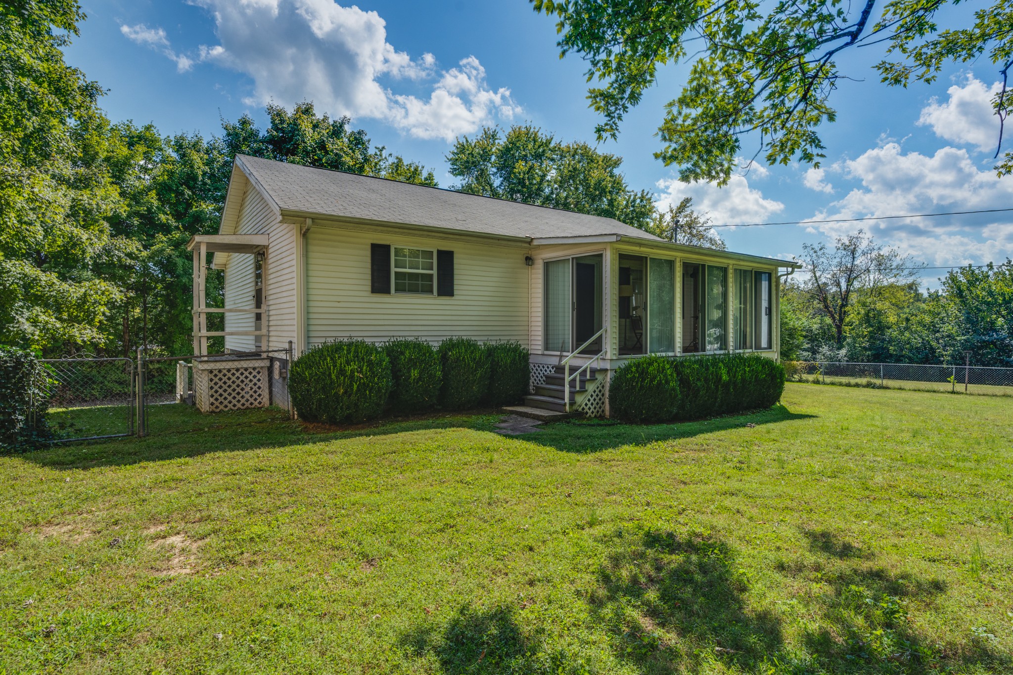 8915 Lyles Road Lyles, TN 37098 - Photo 3 of 39 a view of a house with backyard and porch