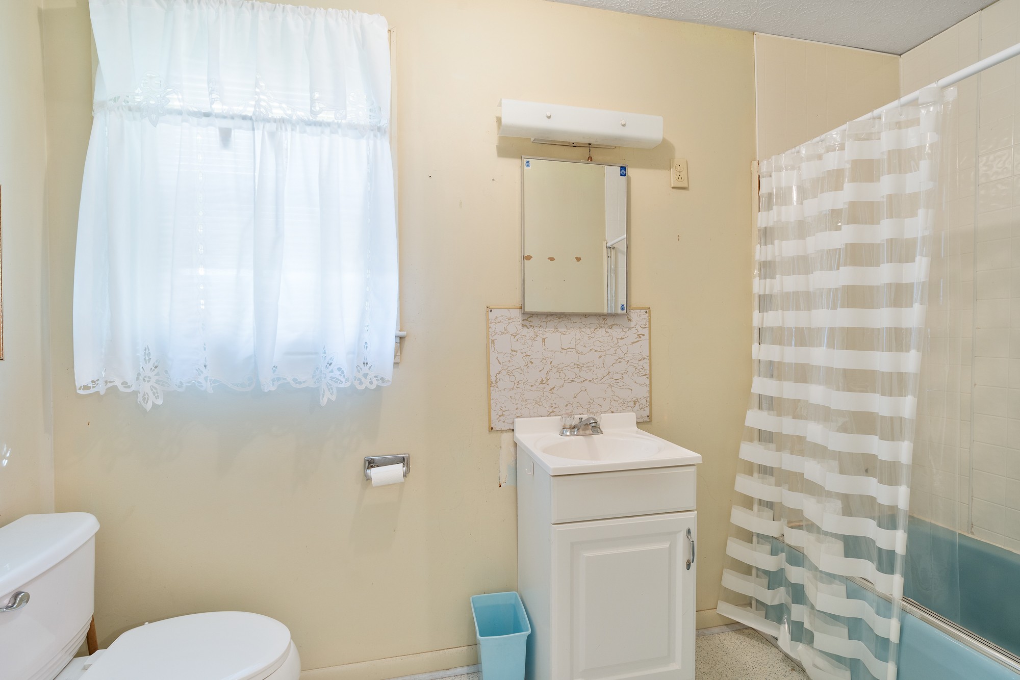 8915 Lyles Road Lyles, TN 37098 - Photo 23 of 39 a bathroom with a toilet sink and vanity