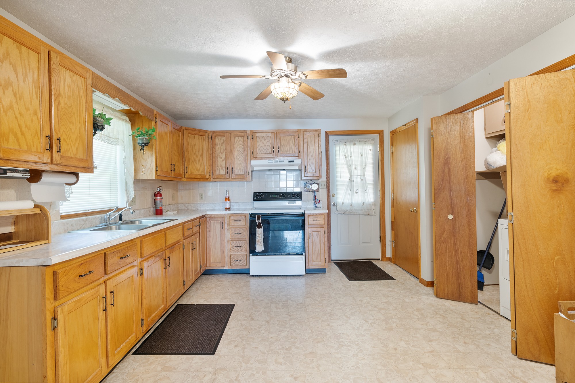 8915 Lyles Road Lyles, TN 37098 - Photo 31 of 39 a kitchen with stainless steel appliances granite countertop a refrigerator and a stove top oven