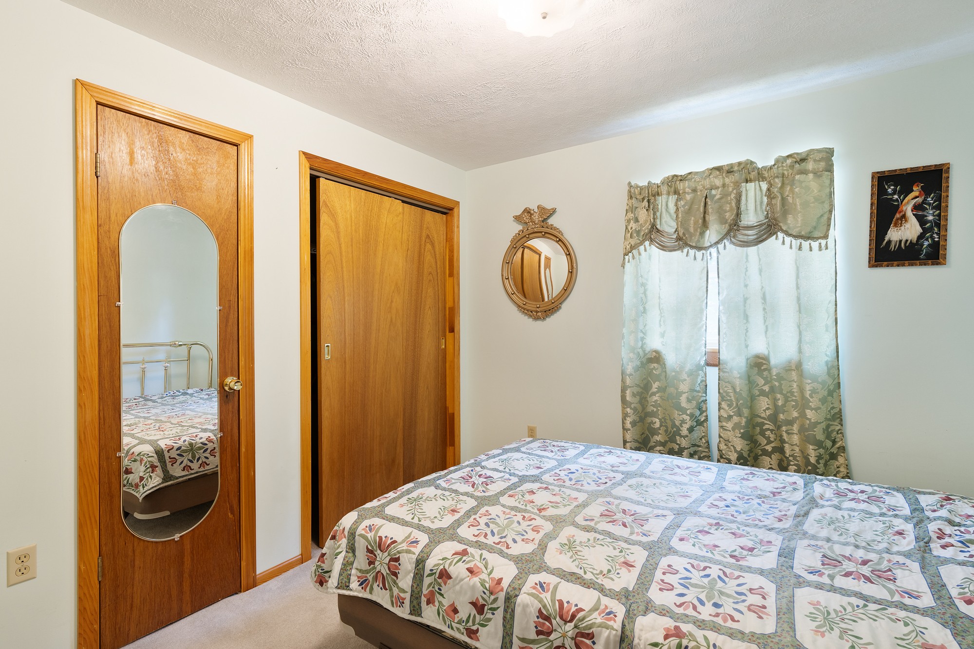 8915 Lyles Road Lyles, TN 37098 - Photo 34 of 39 a bedroom with a bed and a window