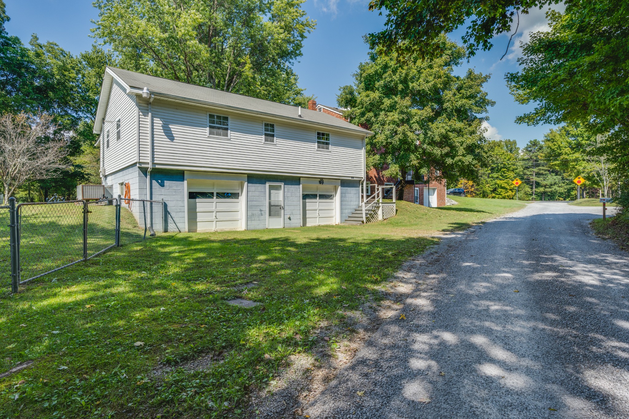 8915 Lyles Road Lyles, TN 37098 - Photo 6 of 39 a front view of a house with a yard