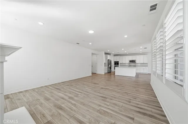 a view of a hallway with closet area