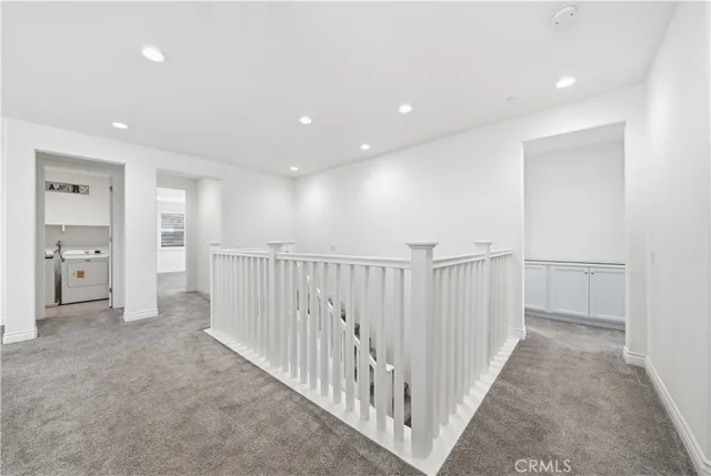 a bathroom with a sink a toilet and a window