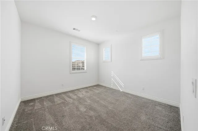 a view of a swimming pool with seating area