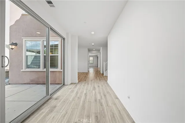 a view of an entryway with wooden floor