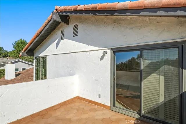 a bedroom with bed and a window