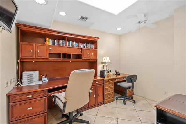 a bedroom with a bed a couch and dresser