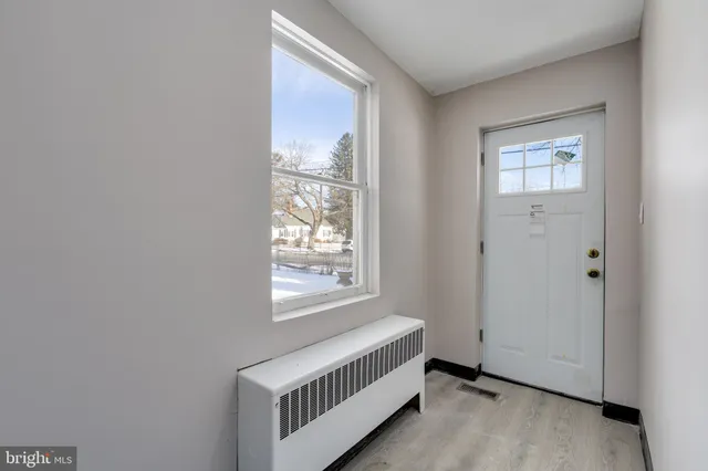 a view of an empty room and window