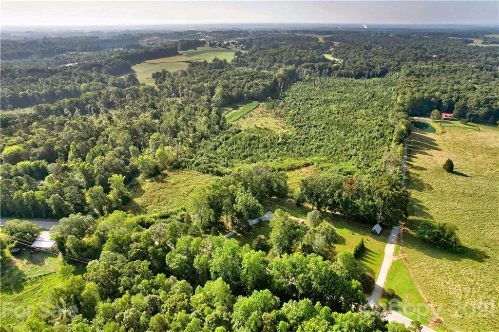 0 Cool Springs Road Cleveland, NC 27013 - Photo 2 of 23 an aerial view of residential houses with outdoor space and trees