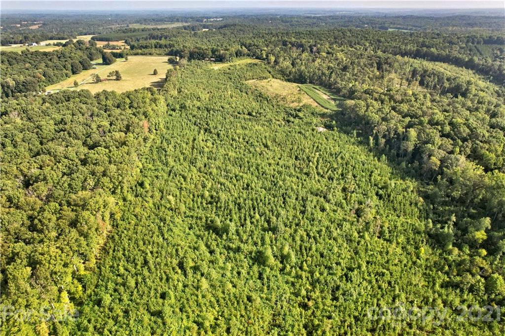 0 Cool Springs Road Cleveland, NC 27013 - Photo 8 of 23 an aerial view of residential houses with outdoor space and trees
