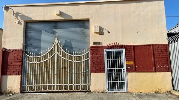 a view of a brick house with many windows
