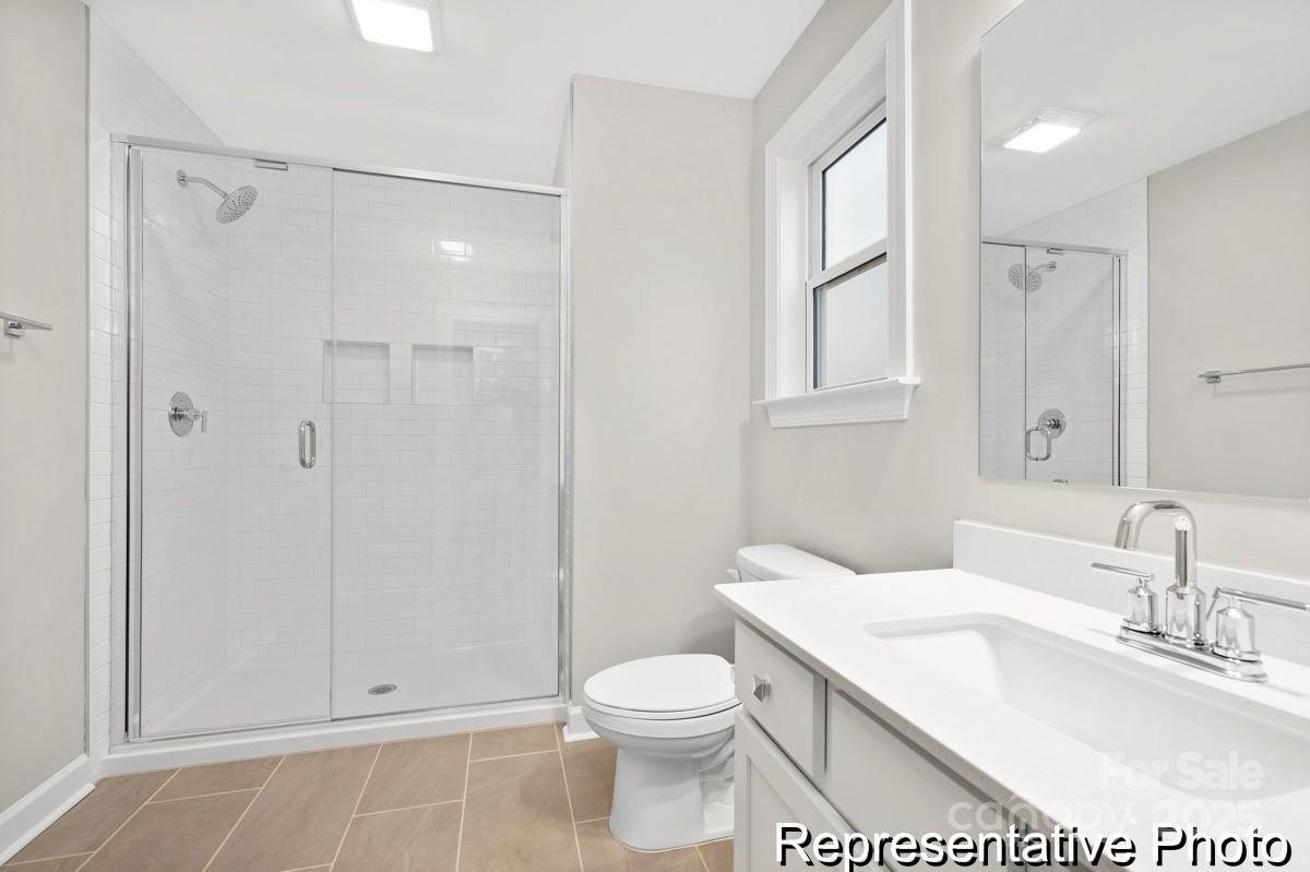 4114 McManus Road, Unit 1P Monroe, NC 28112 - Photo 30 of 37 a bathroom with a sink toilet and shower