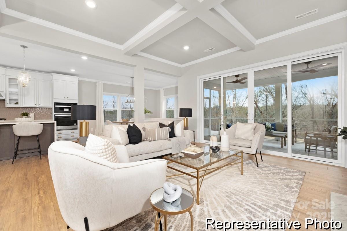 4114 McManus Road, Unit 1P Monroe, NC 28112 - Photo 10 of 37 a living room with furniture and a large window
