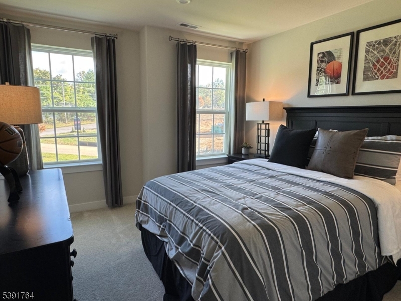 2 Drake Court Milford, NJ 08848 - Photo 3 of 10 a bedroom with a bed a dresser next to a window