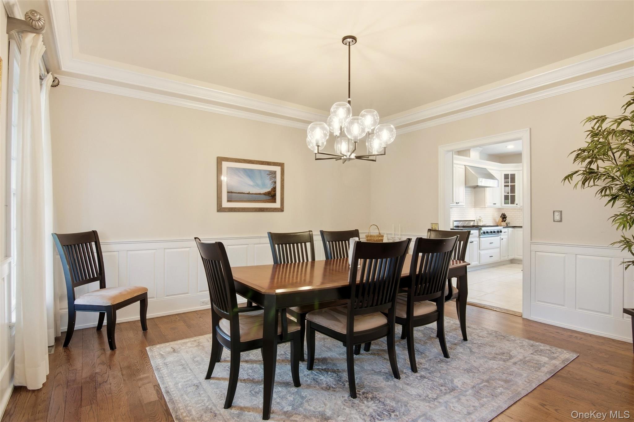 4 Daniel Way Setauket, NY 11733 - Photo 11 of 50 a view of a dining room with furniture and chandelier
