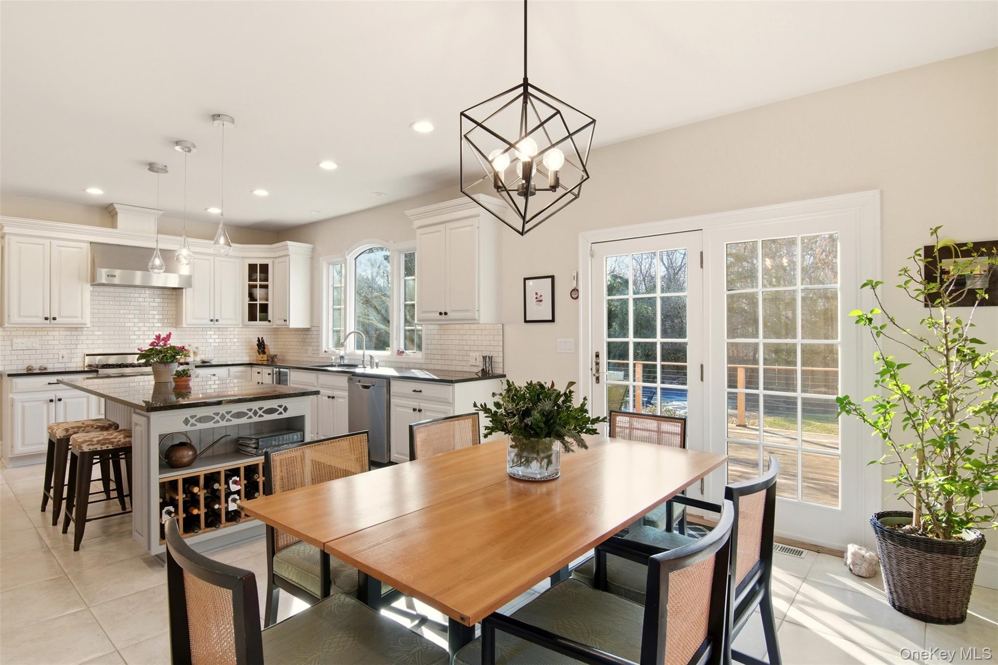 4 Daniel Way Setauket, NY 11733 - Photo 19 of 50 a dining room filled chandelier and wooden floor