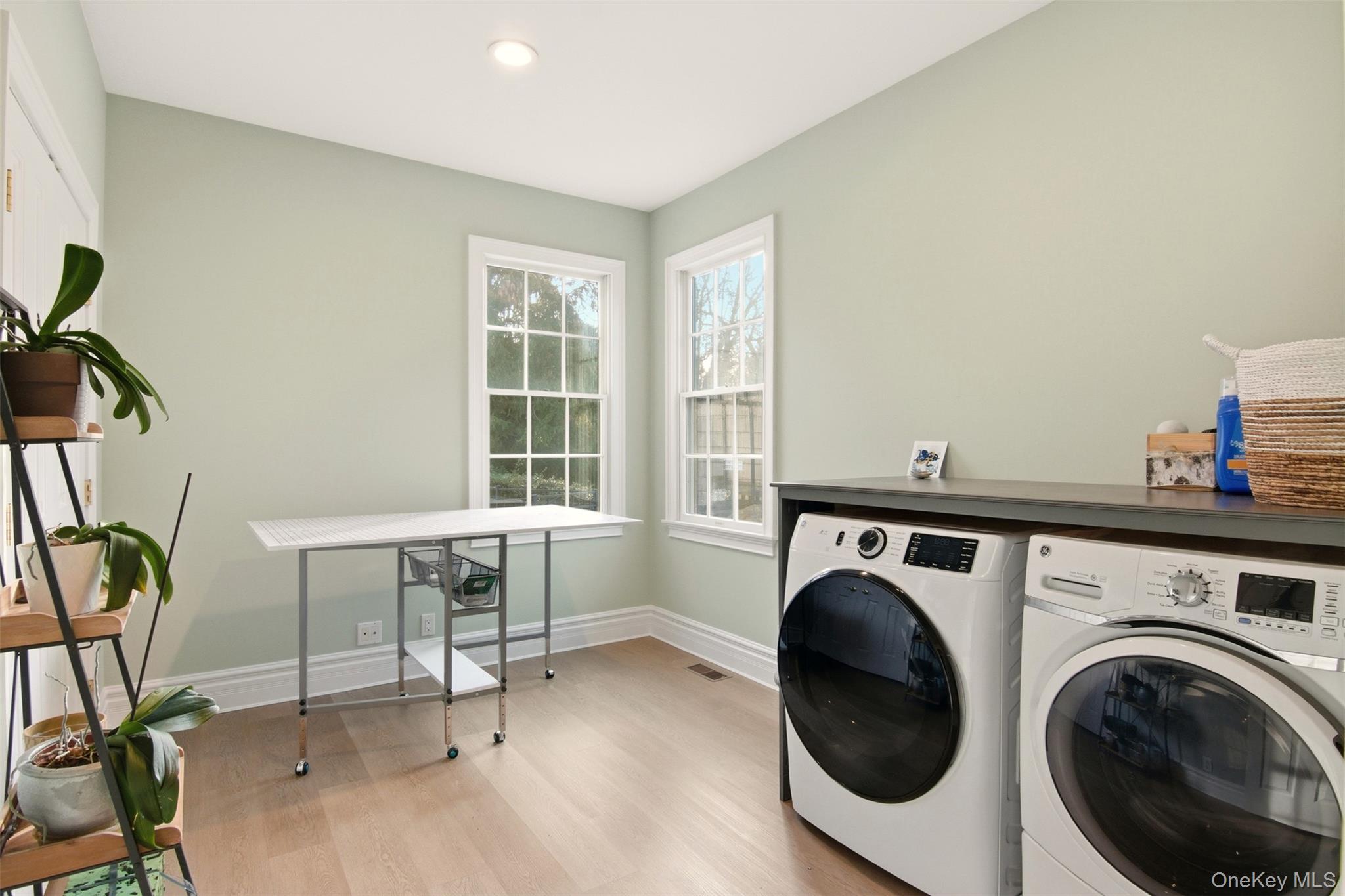 4 Daniel Way Setauket, NY 11733 - Photo 26 of 50 a view of livingroom with furniture and washer