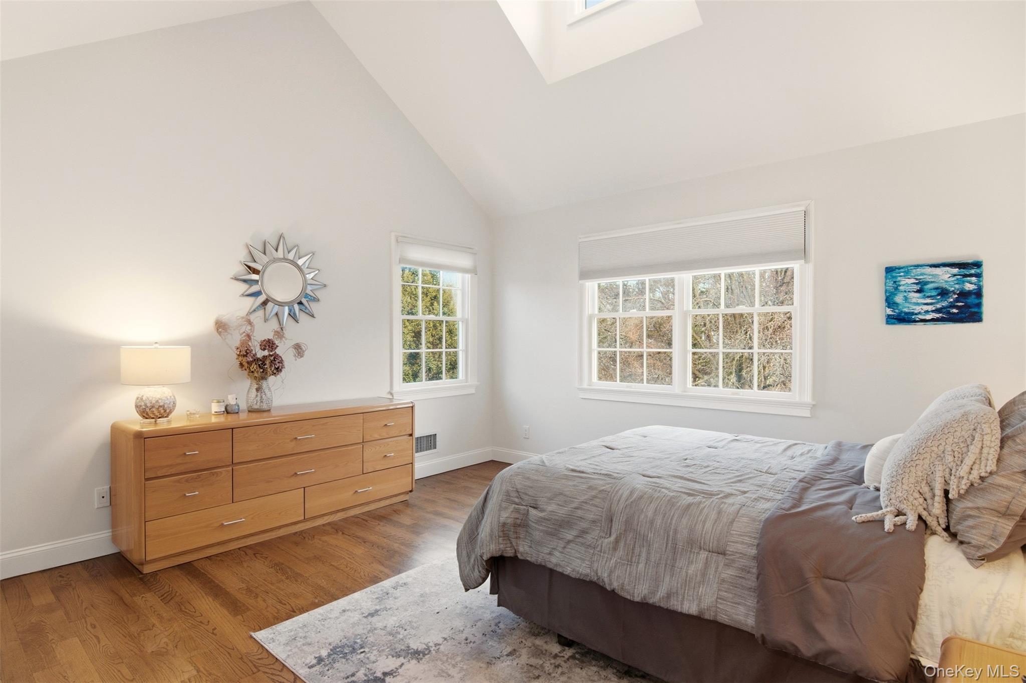 4 Daniel Way Setauket, NY 11733 - Photo 29 of 50 a bedroom with a bed and window