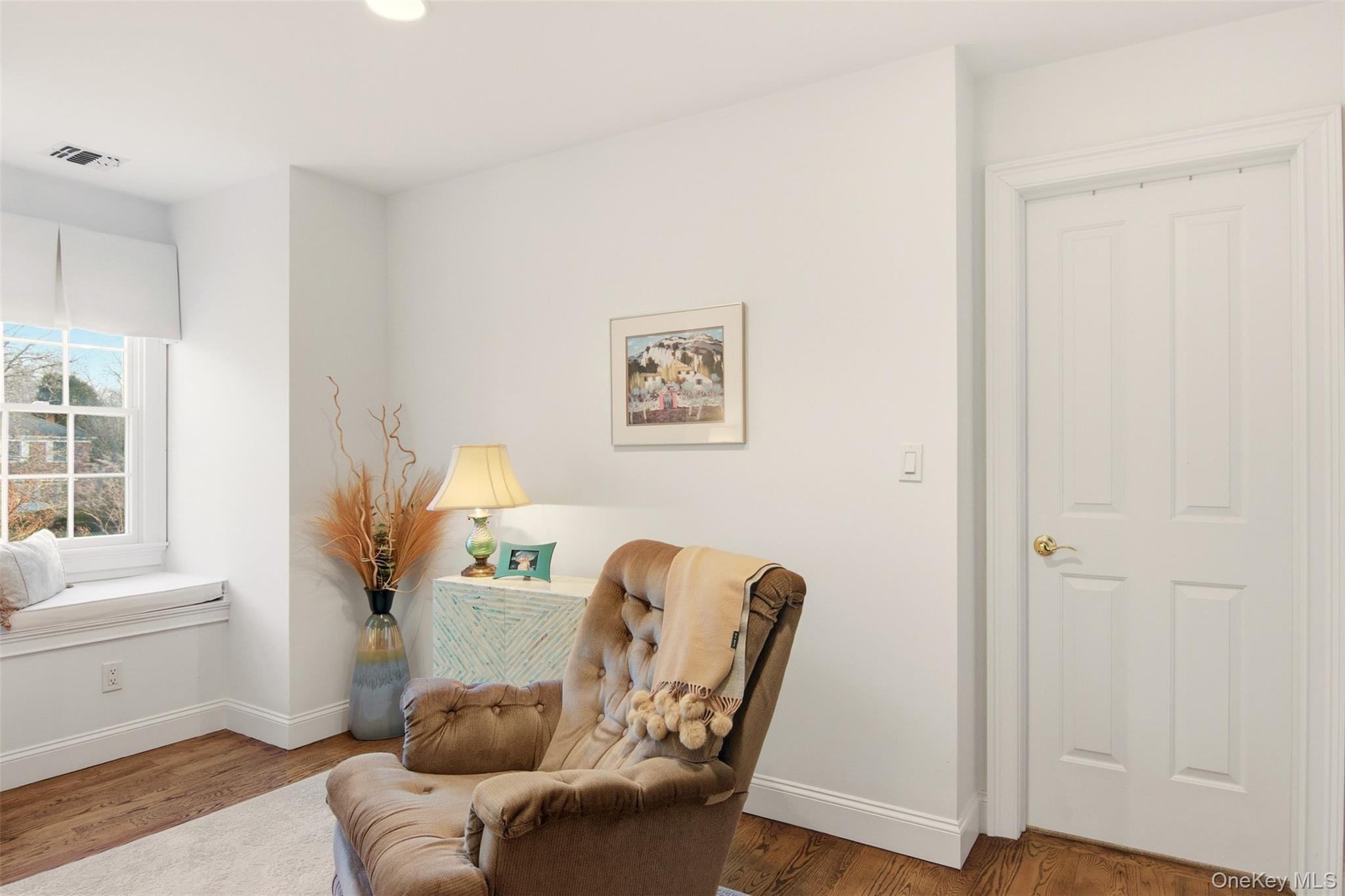 4 Daniel Way Setauket, NY 11733 - Photo 36 of 50 a living room with furniture and a window