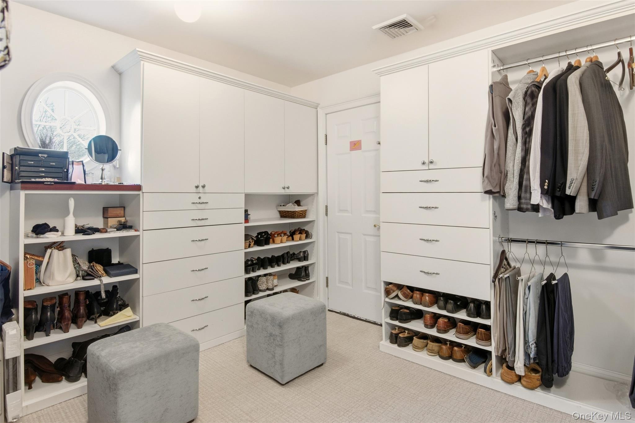 4 Daniel Way Setauket, NY 11733 - Photo 38 of 50 a view of walk in closet with clothes and shoes