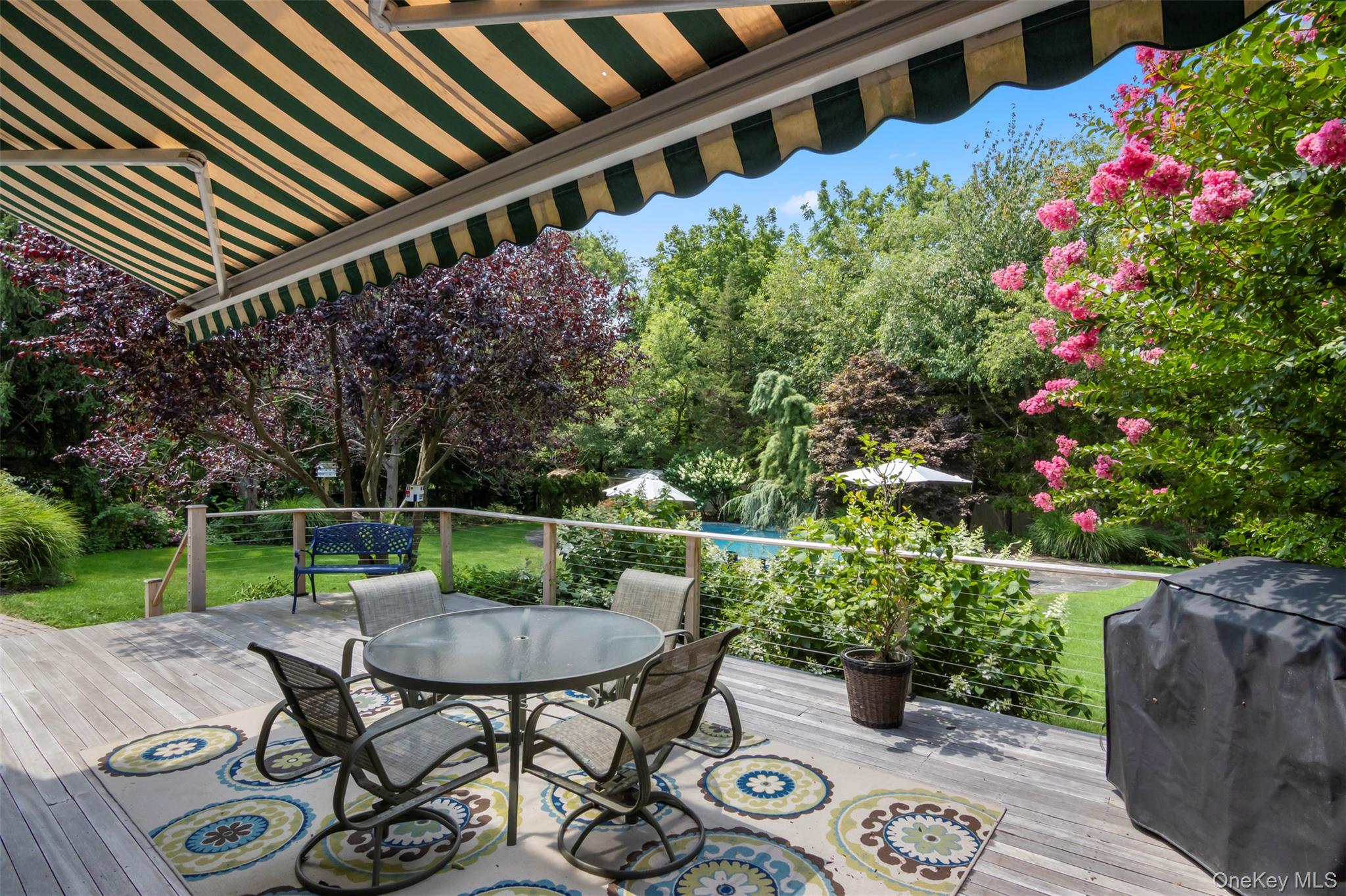 4 Daniel Way Setauket, NY 11733 - Photo 43 of 50 a view of a chairs and table in the backyard