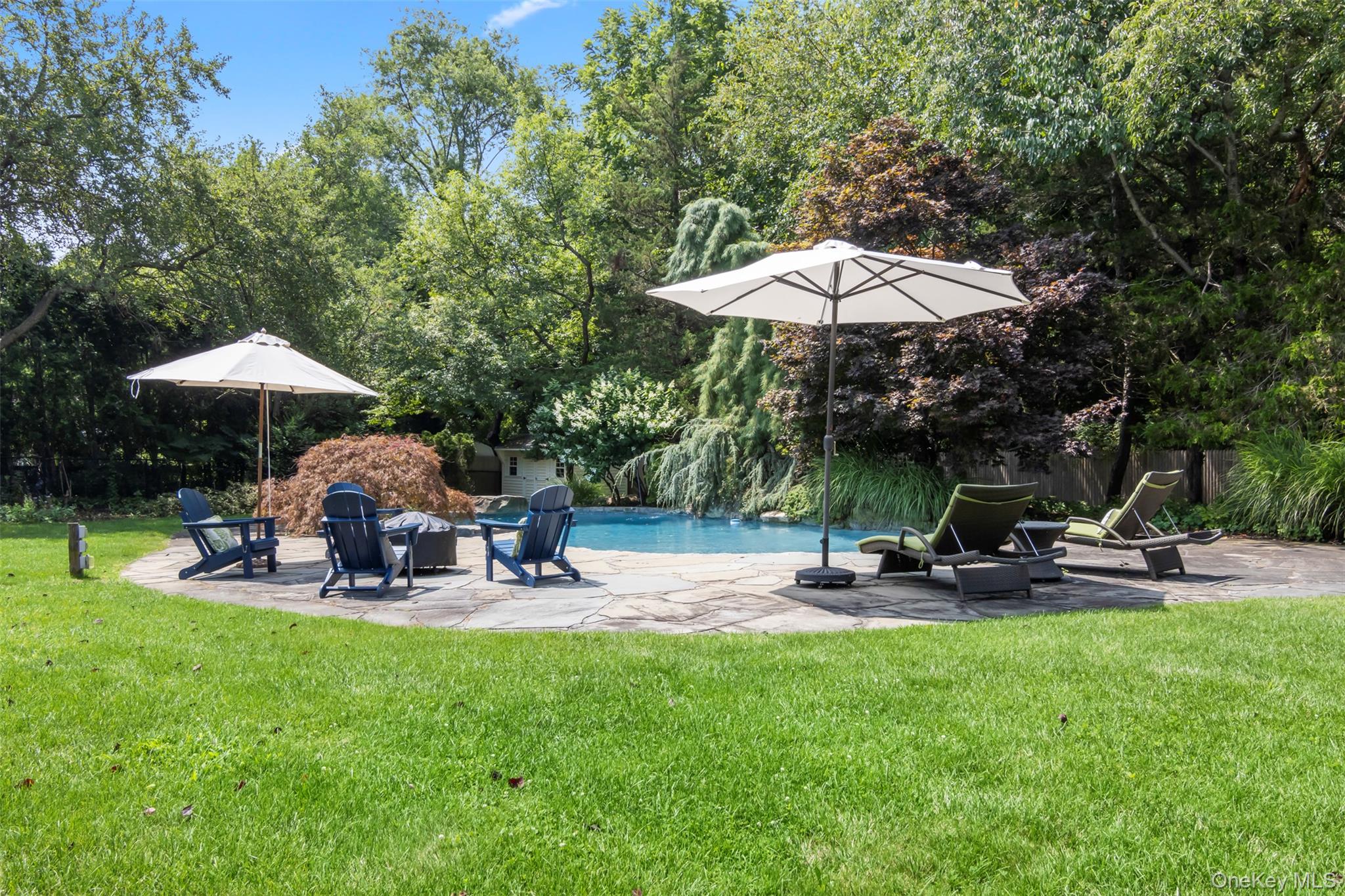 4 Daniel Way Setauket, NY 11733 - Photo 45 of 50 a view of a backyard with sitting area and furniture