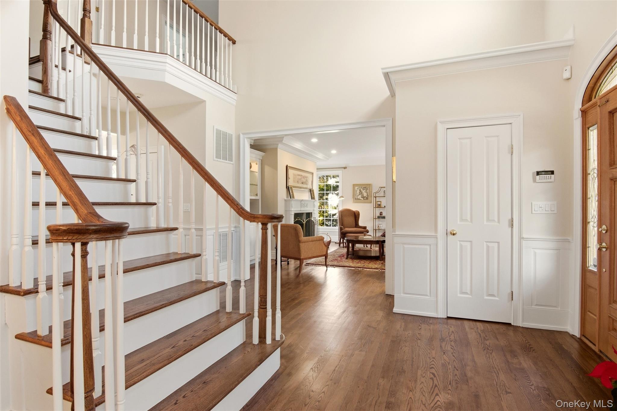 4 Daniel Way Setauket, NY 11733 - Photo 5 of 50 a view of entryway with wooden floor and stairs