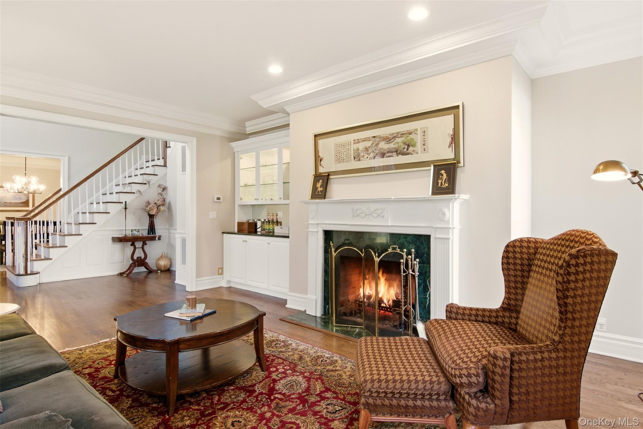 4 Daniel Way Setauket, NY 11733 - Photo 9 of 50 a living room with furniture and a fireplace