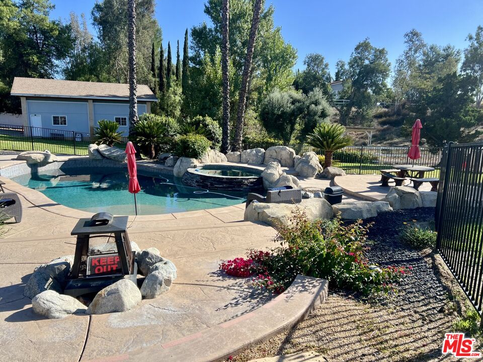 37200 Glen Oaks Road, Unit 3 Temecula, CA 92592 - Photo 20 of 25 a view of backyard with outdoor seating and trees in the background