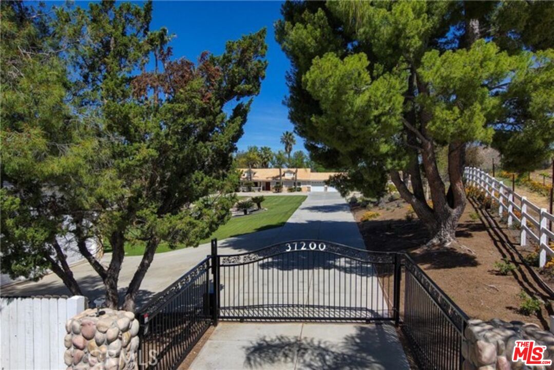 37200 Glen Oaks Road, Unit 3 Temecula, CA 92592 - Photo 21 of 25 a front view of a house with a yard