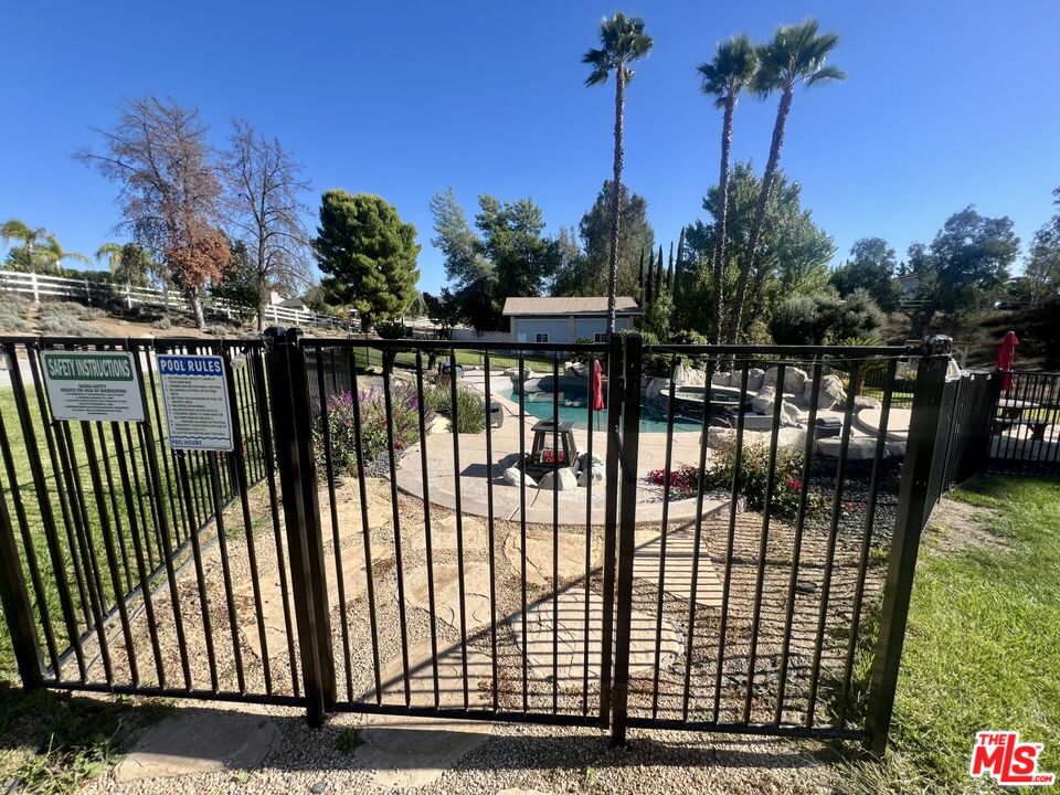 37200 Glen Oaks Road, Unit 3 Temecula, CA 92592 - Photo 25 of 25 a view of a balcony with a floor to ceiling window and palm tree