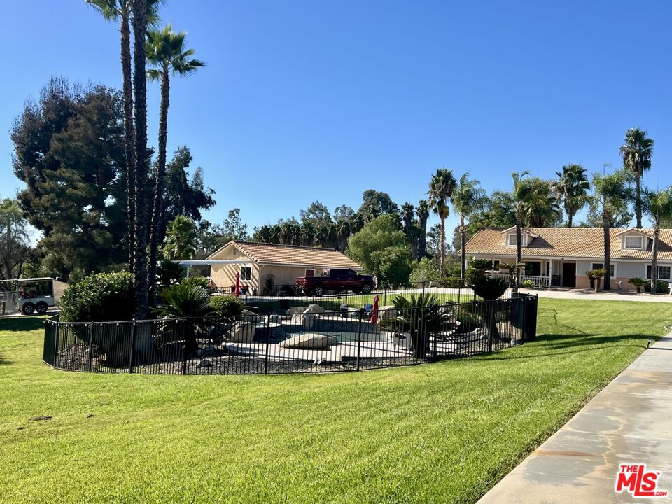 37200 Glen Oaks Road, Unit 3 Temecula, CA 92592 - Photo 3 of 25 a swimming pool with outdoor seating and yard