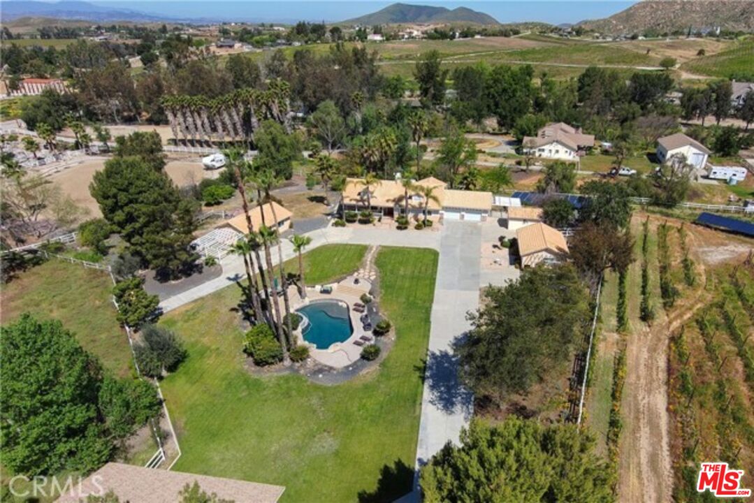 37200 Glen Oaks Road, Unit 3 Temecula, CA 92592 - Photo 5 of 25 a view of a lake with a mountain