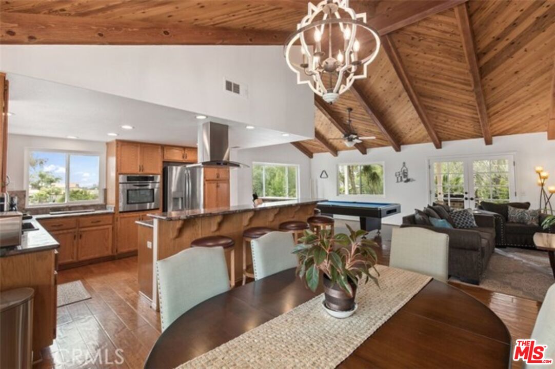 37200 Glen Oaks Road, Unit 3 Temecula, CA 92592 - Photo 6 of 25 a living room with fireplace furniture and a wooden floor