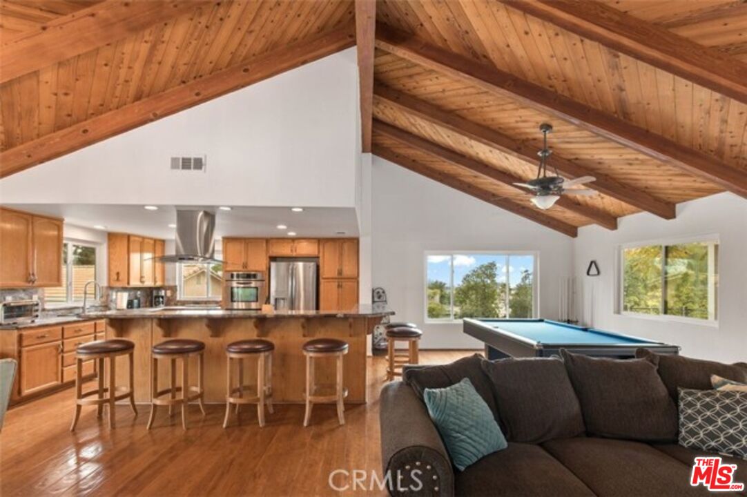 37200 Glen Oaks Road, Unit 3 Temecula, CA 92592 - Photo 7 of 25 a living room with lots of furniture and a large window
