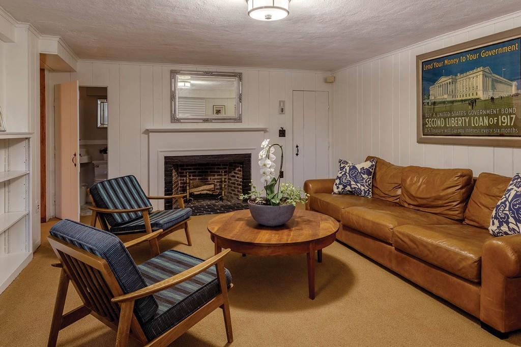58 Randolph Road Brookline, MA 02467 - Photo 12 of 14 a living room with furniture and a fireplace