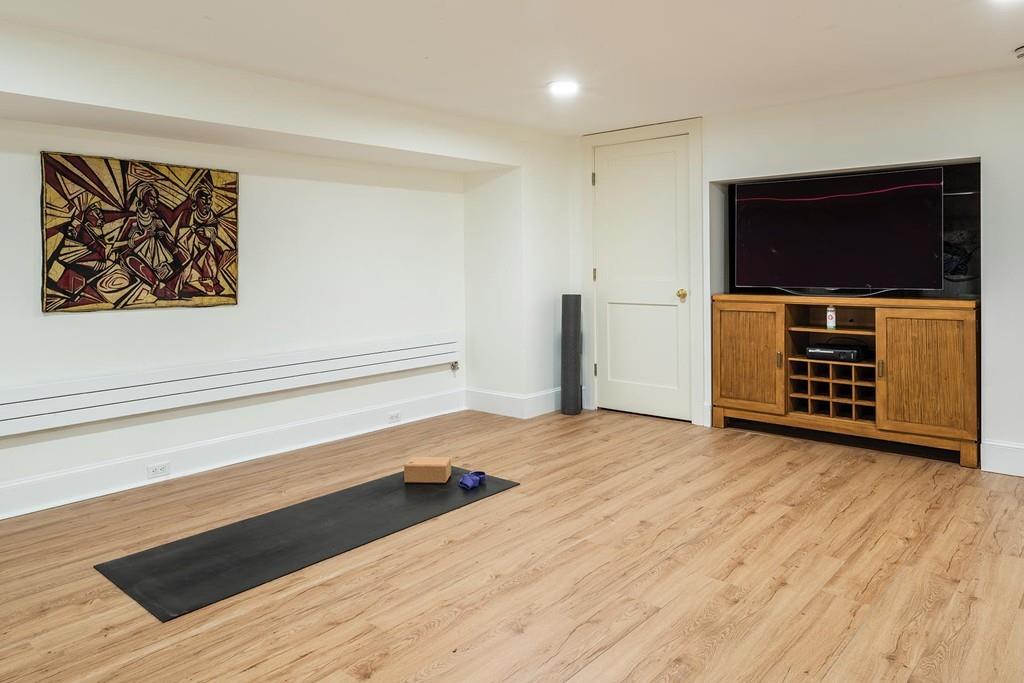 58 Randolph Road Brookline, MA 02467 - Photo 13 of 14 a view of empty room with wooden floor and fan
