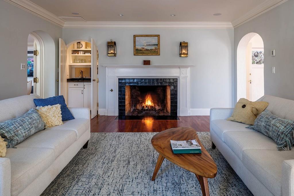58 Randolph Road Brookline, MA 02467 - Photo 2 of 14 a living room with furniture and a fireplace