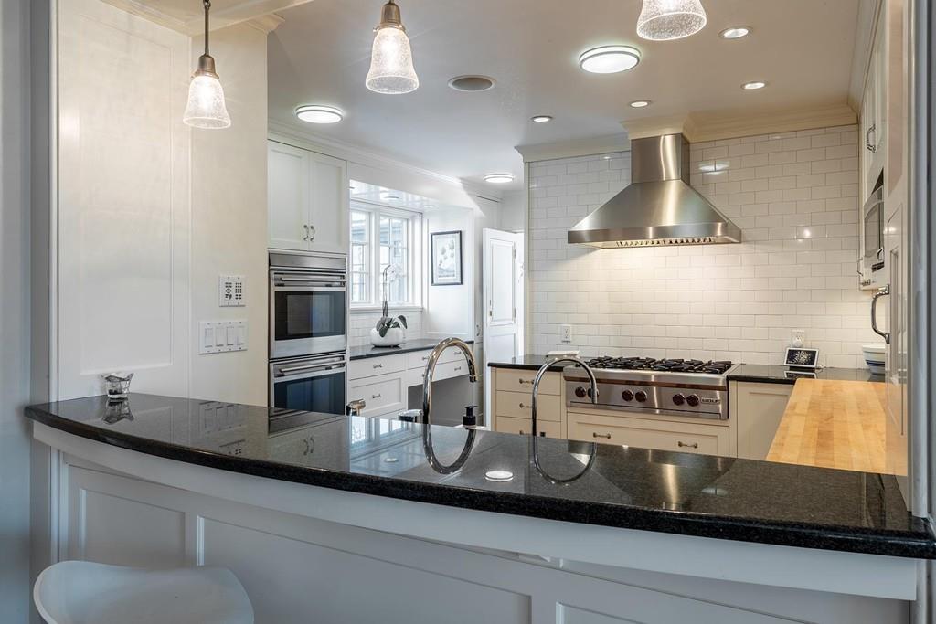 58 Randolph Road Brookline, MA 02467 - Photo 3 of 14 a kitchen with a stove and cabinets