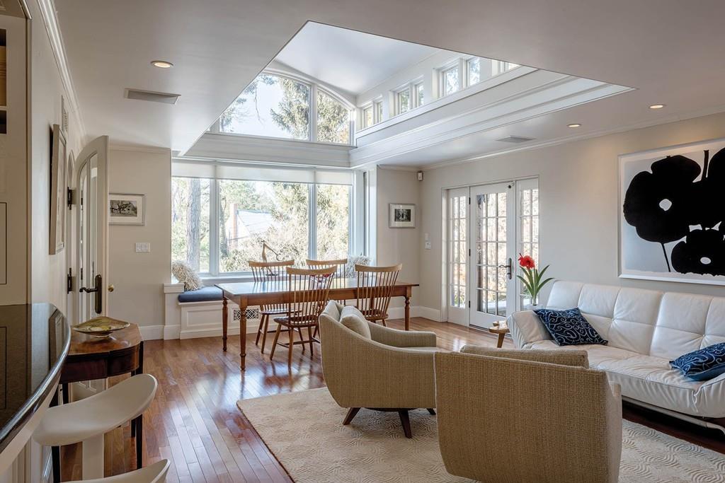 58 Randolph Road Brookline, MA 02467 - Photo 5 of 14 a living room with furniture a dining table and a large window